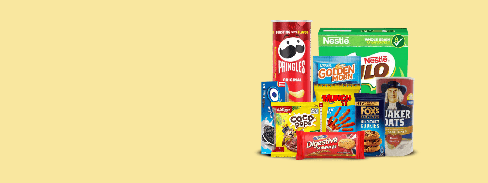 Assorted selection of cereals and snacks including pringles, chocolate bars, and crunchy treats, perfect for any time of the day.